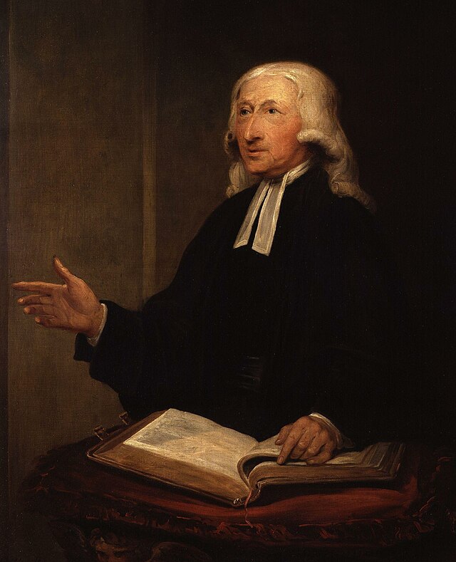 A portrait of John Wesley holding a Bible.